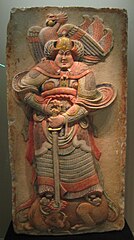 Painted stone relief depicting a warrior from the Later Liang dynasty