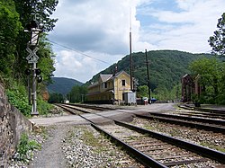 Thurmond Depot, now a New River Gorge National Park and Preserve visitor center, and a single track bridge which crosses the New River.