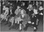 Children watching marionettes in New York, 1935