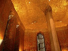 The interior of the Red Room, which is decorated with red-and-gold mosaic tiles