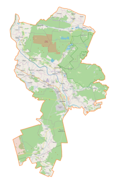 Mapa konturowa powiatu stalowowolskiego, blisko centrum na prawo u góry znajduje się punkt z opisem „Janiki”