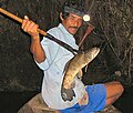 Fishing with a spear, in Peru