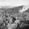 Image 48Soldiers from 3 RAR watch as a Korean village burns in late 1950 (from History of the Australian Army)