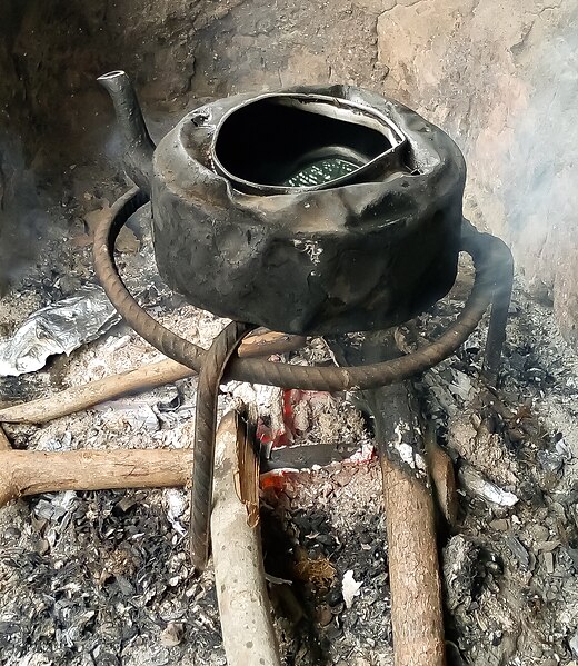 File:Cooking stand with kettle and firewood.jpg