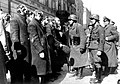 Photo from Nowolipie Street. In the back (from the left) are townhouses at Nowolipie 32 (fragment), 30 and 28. center is Heinrich Klaustermeyer; right Josef Blösche. Similar picture, Stroop Report original caption: "Jewish Rabbis."