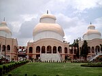 Kali mandir facade, from the main access direction, with Shiva (left) and Radhakrishna (right) temples. The temples themselves open on the other side.