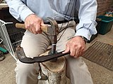 Peening a scythe blade using the jig