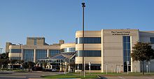 White building as a large hospital. This section shows four stories in height.