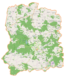 Mapa konturowa powiatu wołowskiego, blisko centrum na dole znajduje się punkt z opisem „Wołów”