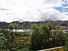 Village in wooded setting with hills