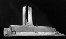 A white plaster design model of the Vimy Memorial from the front side, displayed against a black background