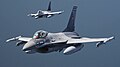 F-16 #1605 and another F-16 fly over the Baltic Sea during the Baltic Air Policing mission, 2023