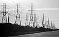 Three abreast electrical pylons in Webster, Texas