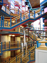 Polychromy and highly saturated colours – Main hall of the Judge Business School, University of Cambridge, England, by John Outram (1995)[50]