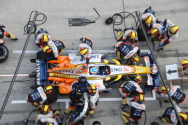 Fernando Alonso pits for new tyres and fuel at the 2008 Chinese Grand Prix.