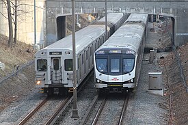 Line 2 and Line 1 subway trains (from left to right) on Line 1