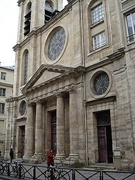 Portal with fronton and three rose windows