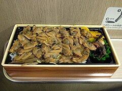 Japanese ekiben lunch box topped with asari clams