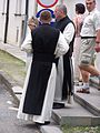 Cistercians in their religious habit (with the black scapular)