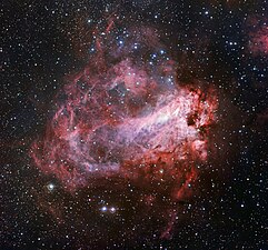 image of the rose-coloured star forming region Messier 17 was captured by the Wide Field Imager on the MPG/ESO 2.2-metre telescope at ESO’s La Silla Observatory in Chile (European Southern Observatory)