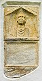 English: Ancient Roman sepulchral stele with inscription and alcove portrait of a soldier on the southern wall Deutsch: Römerzeitliche Grabstele mit Inschrift und Nischenporträt eines Soldaten an der Südwand