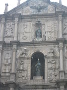 Detail from the Saint Paul church ruins in Macau. The carvings include Jesuit images with Oriental themes, such as the Blessed Virgin Mary stepping on a seven-headed hydra, described in Chinese characters as 'Holy Mother tramples the heads of the dragon'.