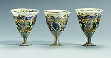 Three ornate cups in a row