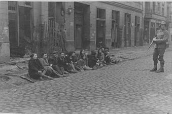 IPN copy #36 They were also found in the underground bunkers Captured Jews in front of Miła 31 and 33 viewed from Zamenhofa Street.