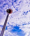 A glowing basketball sculpture soars into the Springfield sky.