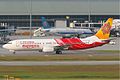 An Air India Express Boeing 737-800 taxiing out, with China Southern Airlines Airbus A319 in the background