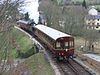 A preserved GWR autotrain, running with the locomotive sandwiched between two driving coaches on the South Devon Railway in 2013