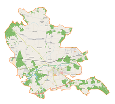 Mapa konturowa gminy Łask, blisko centrum na dole znajduje się punkt z opisem „Łask”