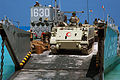 Egyptian M113 leading a convoy of Jordanian vehicles off a US Navy LCU (2005)