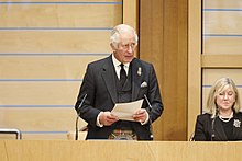 Presiding Officer of the Scottish Parliament Alison Johnstone is seated next to the King.