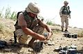 US Soldier removes fuse from a Russian-made mine in Iraq