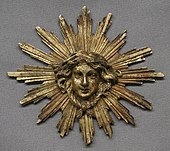 Ornament de ceas; secolul al XVIII-lea; bronz doré; per ansamblu: 12,1 × 13,3 × 2,2 cm; Muzeul Metropolitan de Artă