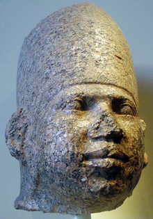 Pink granite head attributed to Huni, Brooklyn Museum