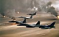 USAF aircraft of the 4th Fighter Wing (F-16, F-15C and F-15E) fly over Kuwaiti oil fires