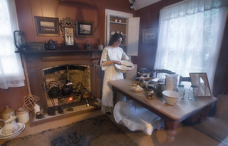 File:Woman batting a mix in a 19th century kitchen, Auckland - 0892.jpg