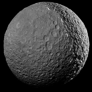 One of Cassini's final close approach to Mimas, imaged from a distance of 41,230 kilometres (25,620 miles) on January 30, 2017. Sunlight reflecting from Saturn is causing the moon to shine on the left.[42]