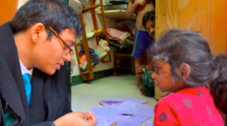 Educational Activist helps four-year-old toddler in Dharavi Slum learn Multiplication.png