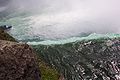 Standing directly above the Canadian falls looking down at one of the Maid of the Mist boats.