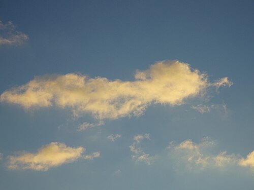 Yellow cloud on blue sky