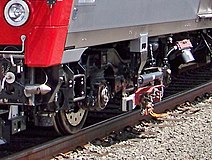 Contact shoe on Metro-North M8 railcar, designed for both over- and under-running third rail.[10]