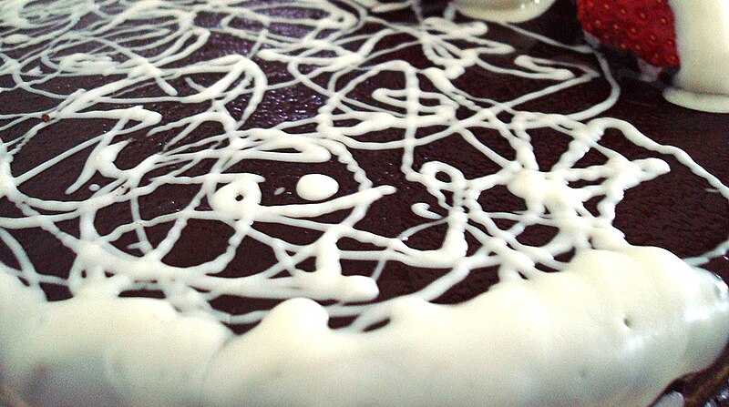 File:Chocolate cake with white chocolate squiggles.jpg