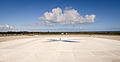 A person standing in the middle of the main landing pad demonstrates its size