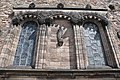 The western façade with 'Freedom' by Percy Portsmouth and niche capitals Phyllis Bone