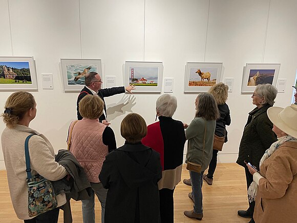 Above: Frank Schulenburg discussing one of pictures featured in the exhibition, File:Old Crissy Field Coast Guard Station in the fog (December 2015).jpg (below, also a featured picture on Wikimedia Commons)