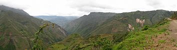 Panorama of Tingo valley (1700 m) with Kuelap (3000 m) in the background, center right top.