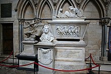 Three monuments of varying sizes and shapes, cordoned off by a red rope